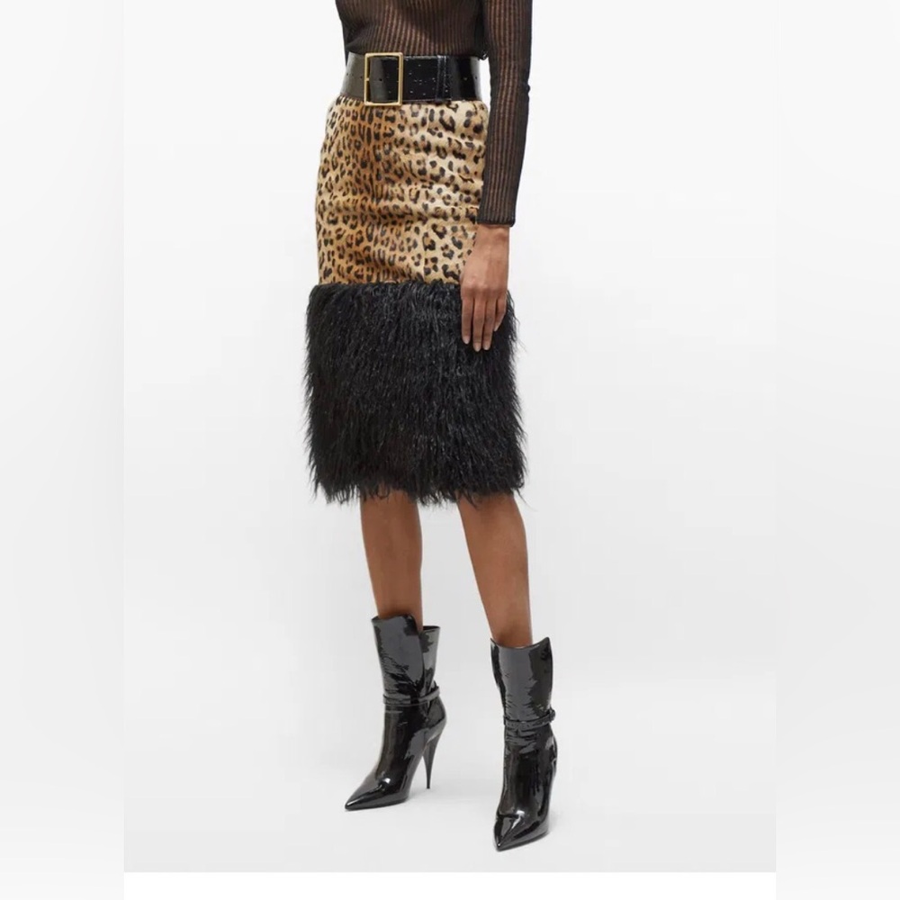 Authentic Saint Laurent skirt. Never worn. Two pockets, back split, mid length.
